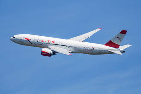 Austrian Airlines special sticker Boeing 777-200 OE-LPD passenger plane departure and take off at...