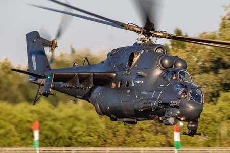 Hungarian Air Force Mil Helicopters Mi-24P Hind 331 military attack helicopter flying over Szolnok...