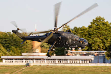 Hungarian Air Force Mil Helicopters Mi-24P Hind 331 military attack helicopter flying over Szolnok city downtownのeditorial素材
