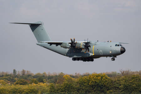 Untitled airplane. Military transport plane. Aircraft without title at airport. Aviation theme. In...