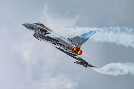 Zeltweg, Austria - June 29, 2013: Military fighter jet plane at air base. Air force flight operation. Aviation and aircraft. Air defense. Military industry. Fly and flying.のeditorial素材