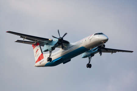 Vienna, Austria - September 24, 2011: Austrian Airlines passenger plane at airport. Schedule flight travel. Aviation and aircraft. Air transport. Global international transportation. Fly and flying.のeditorial素材
