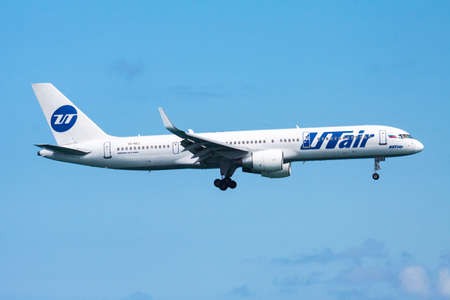 Phuket, Thailand - November 25, 2013: UTair Aviation passenger plane at airport. Schedule flight travel. Aviation and aircraft. Air transport. Global international transportation. Fly and flying.のeditorial素材