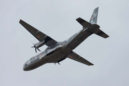 Radom, Poland - August 22, 2013: Military transport plane at air base. Air force flight operation. Aviation and aircraft. Air defense. Military industry. Fly and flying.のeditorial素材