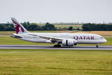 Vienna, Austria - July 22, 2016: Qatar Airways passenger plane at airport. Schedule flight travel. Aviation and aircraft. Air transport. Global international transportation. Fly and flying.のeditorial素材