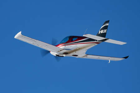 Zell am See, Austria - February 14, 2018: Commercial plane at airport and airfield. Small and sport aircraft. General aviation industry. Vip transport. Civil utility transportation. Fly and flying.のeditorial素材