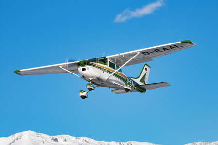 Zell am See, Austria - February 14, 2018: Commercial plane at airport and airfield. Small and sport aircraft. General aviation industry. Vip transport. Civil utility transportation. Fly and flying.のeditorial素材