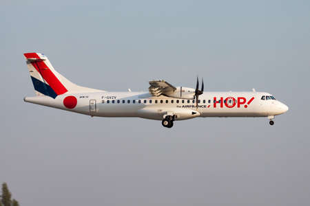 Paris, France - April 18, 2015: Air France HOP passenger plane at airport. Schedule flight travel. Aviation and aircraft. Air transport. Global international transportation. Fly and flying.のeditorial素材