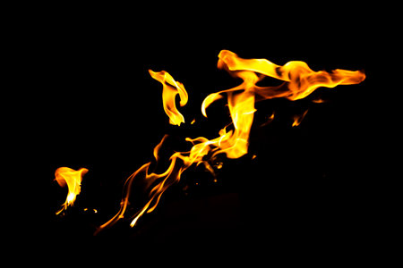 Fire flame texture. Burning material backdrop. Burn effect pattern. Blaze and torch wallpaper. Heat and haze backdrop. Exploison and hot background.の写真素材