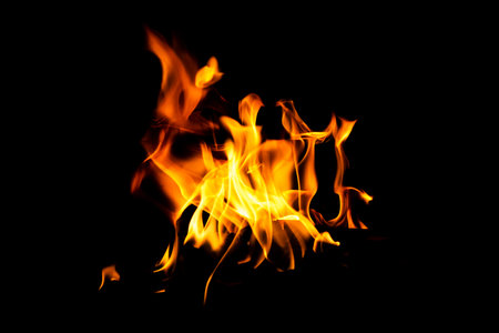 Fire flame texture. Burning material backdrop. Burn effect pattern. Blaze and torch wallpaper. Heat and haze backdrop. Exploison and hot background.の写真素材