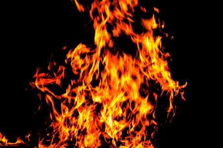 Fire flame texture. Burning material backdrop. Burn effect pattern. Blaze and torch wallpaper. Heat and haze backdrop. Exploison and hot background.の写真素材