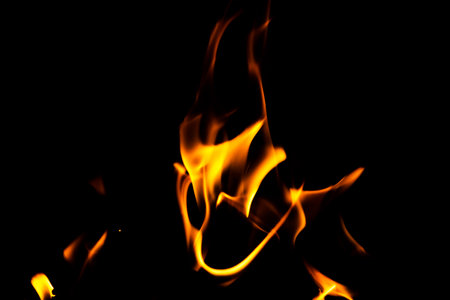 Fire flame texture. Burning material backdrop. Burn effect pattern. Blaze and torch wallpaper. Heat and haze backdrop. Exploison and hot background.の写真素材
