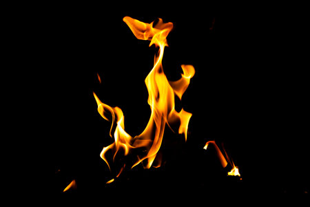 Fire flame texture. Burning material backdrop. Burn effect pattern. Blaze and torch wallpaper. Heat and haze backdrop. Exploison and hot background.の写真素材