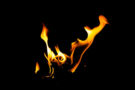 Fire flame texture. Burning material backdrop. Burn effect pattern. Blaze and torch wallpaper. Heat and haze backdrop. Exploison and hot background.の写真素材