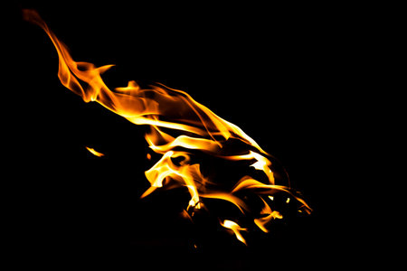 Fire flame texture. Burning material backdrop. Burn effect pattern. Blaze and torch wallpaper. Heat and haze backdrop. Exploison and hot background.の写真素材