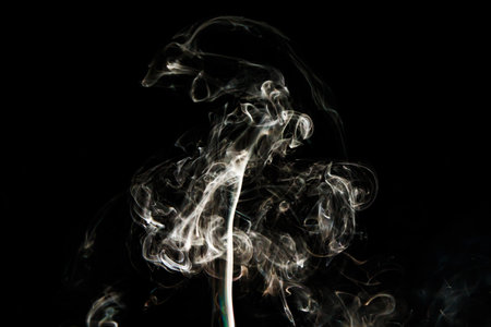 Smoke effect texture. Isolated background. Black and dark background. Smokey fire and mystical effect. Spirit wave. Photo realistic mist stock image.の写真素材