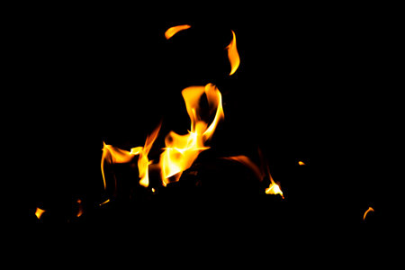 Fire flame texture. Burning material backdrop. Burn effect pattern. Blaze and torch wallpaper. Heat and haze backdrop. Exploison and hot background.の写真素材