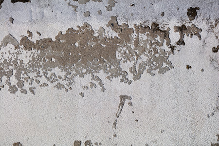 Cracked and abstract grunge texture. Aged material surface backdrop. Weathered effect pattern. Old and dirty background. Graphic resource.の写真素材
