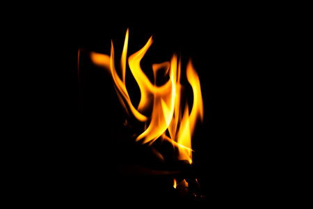 Fire flame texture. Burning material backdrop. Burn effect pattern. Blaze and torch wallpaper. Heat and haze backdrop. Exploison and hot background.の写真素材