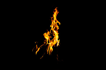 Fire flame texture. Burning material backdrop. Burn effect pattern. Blaze and torch wallpaper. Heat and haze backdrop. Exploison and hot background.の写真素材