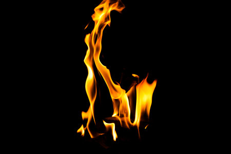 Fire flame texture. Burning material backdrop. Burn effect pattern. Blaze and torch wallpaper. Heat and haze backdrop. Exploison and hot background.の写真素材