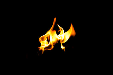 Fire flame texture. Burning material backdrop. Burn effect pattern. Blaze and torch wallpaper. Heat and haze backdrop. Exploison and hot background.の写真素材