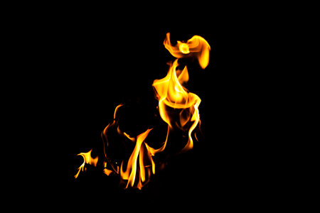 Fire flame texture. Burning material backdrop. Burn effect pattern. Blaze and torch wallpaper. Heat and haze backdrop. Exploison and hot background.の写真素材