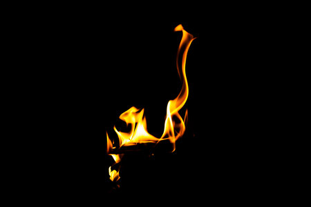Fire flame texture. Burning material backdrop. Burn effect pattern. Blaze and torch wallpaper. Heat and haze backdrop. Exploison and hot background.の写真素材