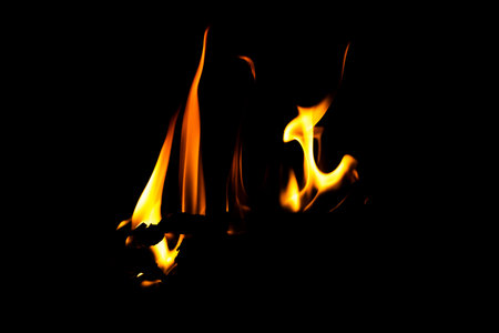 Fire flame texture. Burning material backdrop. Burn effect pattern. Blaze and torch wallpaper. Heat and haze backdrop. Exploison and hot background.の写真素材