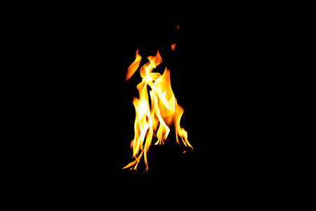 Fire flame texture. Burning material backdrop. Burn effect pattern. Blaze and torch wallpaper. Heat and haze backdrop. Exploison and hot background.の写真素材