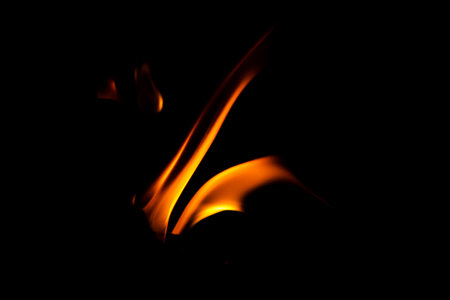 Fire flame texture. Burning material backdrop. Burn effect pattern. Blaze and torch wallpaper. Heat and haze backdrop. Exploison and hot background.の写真素材