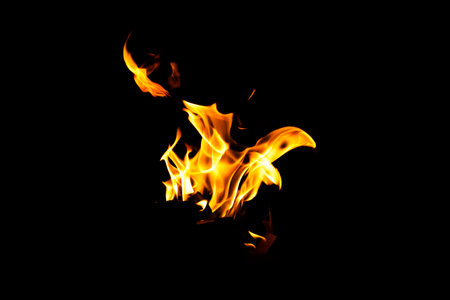 Fire flame texture. Burning material backdrop. Burn effect pattern. Blaze and torch wallpaper. Heat and haze backdrop. Exploison and hot background.の写真素材