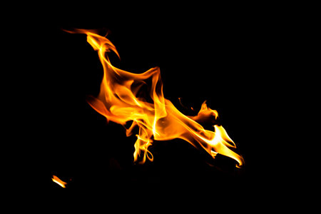 Fire flame texture. Burning material backdrop. Burn effect pattern. Blaze and torch wallpaper. Heat and haze backdrop. Exploison and hot background.の写真素材