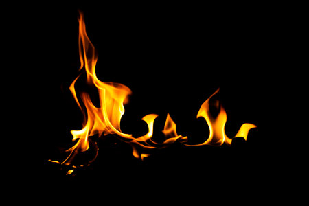 Fire flame texture. Burning material backdrop. Burn effect pattern. Blaze and torch wallpaper. Heat and haze backdrop. Exploison and hot background.の写真素材