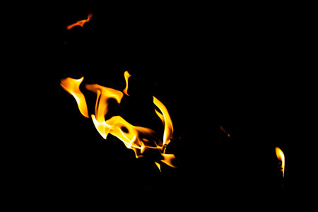 Fire flame texture. Burning material backdrop. Burn effect pattern. Blaze and torch wallpaper. Heat and haze backdrop. Exploison and hot background.の写真素材