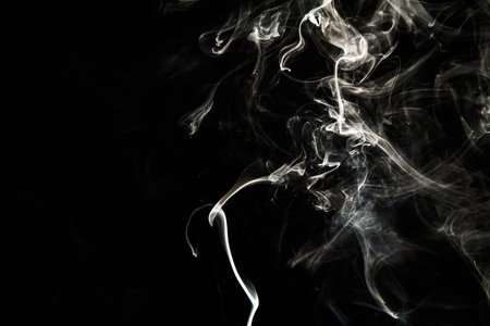Smoke effect texture. Isolated background. Black and dark background. Smokey fire and mystical effect. Spirit wave. Photo realistic mist stock image.の写真素材