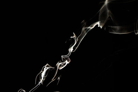 Smoke effect texture. Isolated background. Black and dark background. Smokey fire and mystical effect. Spirit wave. Photo realistic mist stock image.の写真素材