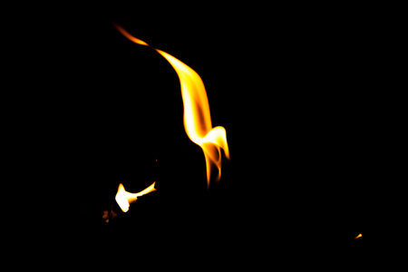 Fire flame texture. Burning material backdrop. Burn effect pattern. Blaze and torch wallpaper. Heat and haze backdrop. Exploison and hot background.の写真素材