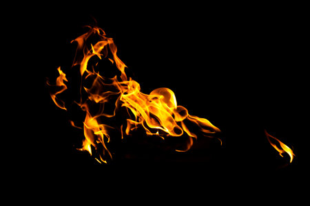 Fire flame texture. Burning material backdrop. Burn effect pattern. Blaze and torch wallpaper. Heat and haze backdrop. Exploison and hot background.の写真素材