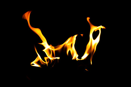 Fire flame texture. Burning material backdrop. Burn effect pattern. Blaze and torch wallpaper. Heat and haze backdrop. Exploison and hot background.の写真素材