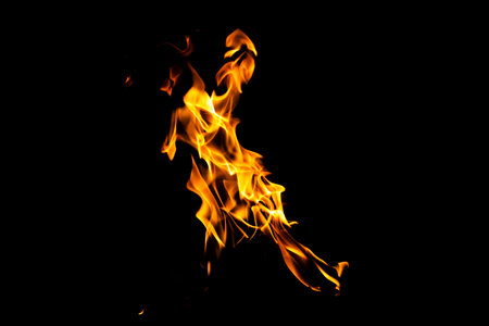 Fire flame texture. Burning material backdrop. Burn effect pattern. Blaze and torch wallpaper. Heat and haze backdrop. Exploison and hot background.の写真素材