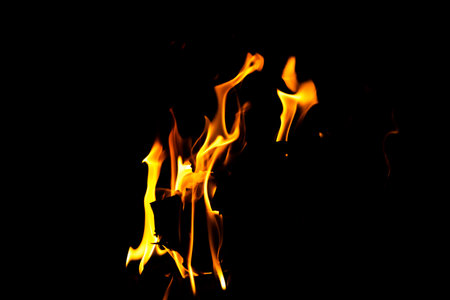 Fire flame texture. Burning material backdrop. Burn effect pattern. Blaze and torch wallpaper. Heat and haze backdrop. Exploison and hot background.の写真素材