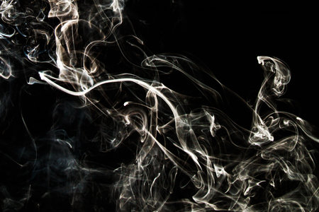 Smoke effect texture. Isolated background. Black and dark background. Smokey fire and mystical effect. Spirit wave. Photo realistic mist stock image.の写真素材