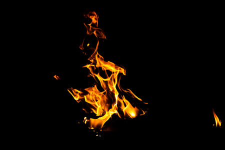Fire flame texture. Burning material backdrop. Burn effect pattern. Blaze and torch wallpaper. Heat and haze backdrop. Exploison and hot background.の写真素材