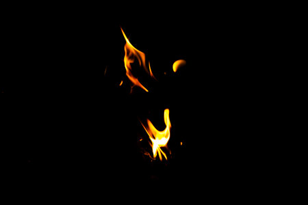 Fire flame texture. Burning material backdrop. Burn effect pattern. Blaze and torch wallpaper. Heat and haze backdrop. Exploison and hot background.の写真素材