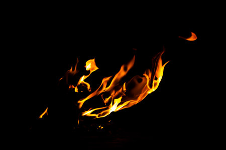 Fire flame texture. Burning material backdrop. Burn effect pattern. Blaze and torch wallpaper. Heat and haze backdrop. Exploison and hot background.の写真素材