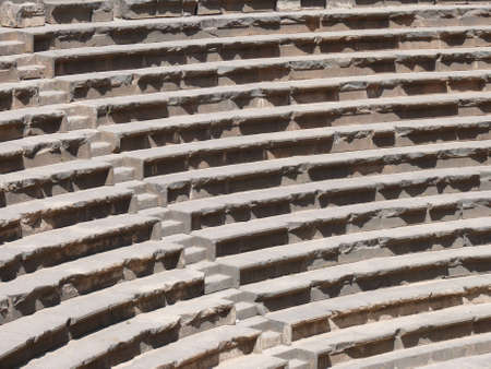 Close up of rows of seats and stairway, auditorium, ancient Roman amphitheatre, Bosra, Syriaの写真素材