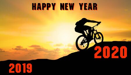 Happy new year 2020 Young men ride mountain bicycles from numbers 2019 to 2020 numbers.の写真素材