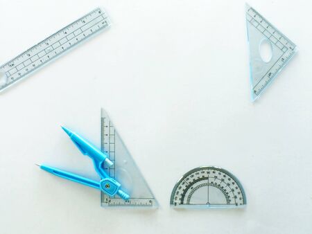 White office desk with school supplies on top