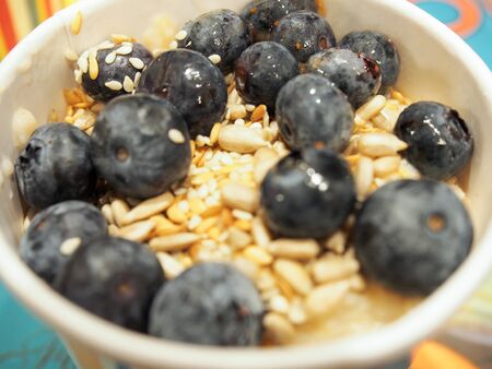 Porridge with blueberries, seeds, honey? healthy and clean breakfastのeditorial素材